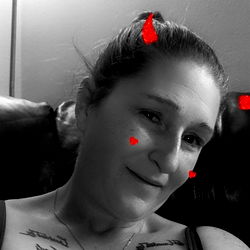 Sassy Woman in Tattoos Shows Off Her Red Heart Tattoo