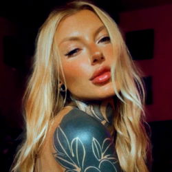 A Model's Tattooed Arm in a Nearby Studio