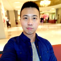 A Model with a Blue Jacket in an Interior Lobby