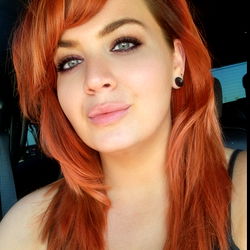 Kathryn, a vibrant red-haired woman