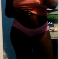 Athena K. in a Pink Sports Bra