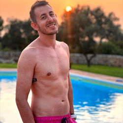 Fitness Enthusiast Enjoying a Poolside Sunset