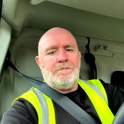 A Construction Worker in His Vehicle