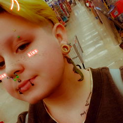 OnlyFans Model Cupid, Showcasing a Tattoo Artwork