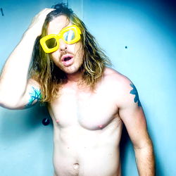Kurtblanko, A Shirtless Model in Vivid Yellow Goggles