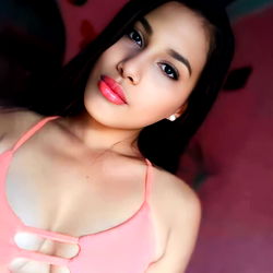 Katerin, a stunning OnlyFans model in a pink top
