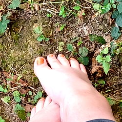 A model photo featuring a foot in the sand, presumably on an Ireland-inspired beach setting. The image showcases a natural and relaxing environment with green foliage, and the text provides context that it is inspired by Ireland.