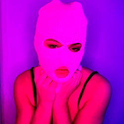 Mysterious OnlyFans Model in a Purple Room