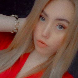 An individual posing for a photograph