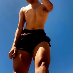 Young Man in Sportswear on Beach