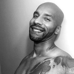 Achilles, the muscular OnlyFans model poses for a powerful photo.