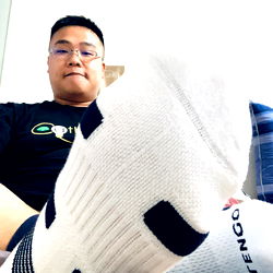 Man in a room with a sock on his leg