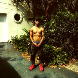 Fitness Model Showcasing Abs and Biceps