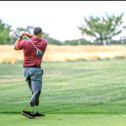 A Man Playing Golf on a Course