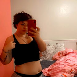 Stylish Woman Posing in a Mirror in Her Room