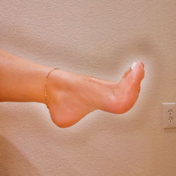 Intimate Foot Close-up with Gold Ankle Bracelet