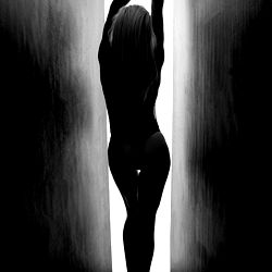 Age-old Photograph of a Model in a Dark Hallway