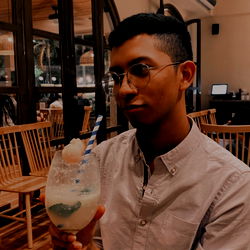 Young Man Enjoying a Cocktail