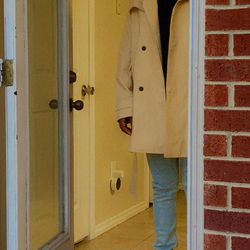 Model Standing in Front Doorway