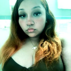 Alondra, a vibrant model in a black and white photo