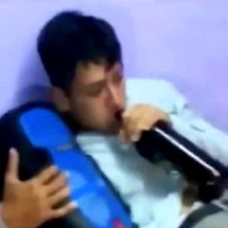 A Young Man Enthusiastically Consuming a Drink