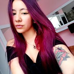 Model Genesis Showcasing Stunning Pink Hair and Tattoo, 18+