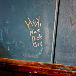 Witty Graffiti on Wall in Bar