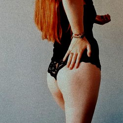 A captivating OnlyFans model pose in black lingerie