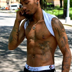 Celebrity Model Longstroke69, Shirtless, Phone in Hand