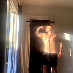 Onlyfans Model Don Mostrando Shows Off His Physique in Bright Window Light
