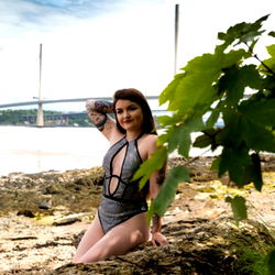 Jessica, Model in a Bikini on the Rocks by the Water
