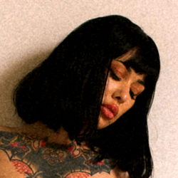 Gothic Tattoo Model in Intimate Pose