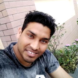 A Young Man Posing with a Smile