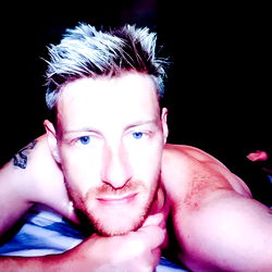 Cape Town Model in Shirtless Pose with Eyes Closed, Resting Head on Hand