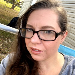 Woman in Glasses with Smiling Expression