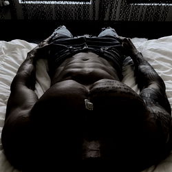 OnlyFans Model Showcasing Physique on Bed