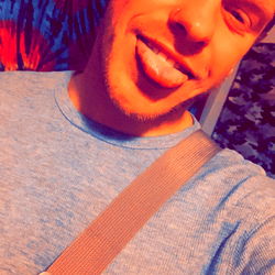 Alexander Mohler - A Smiling Model Holding a Knife, Exuding Confidence