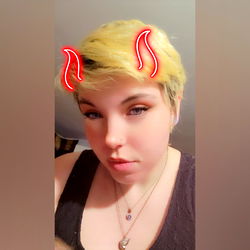 Onlyfans Model 'Lobo Mariposa' with Elegant Makeup and a Mischievous Grin