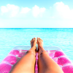 Tropical Getaway: Relaxing on a Floating Lounger in Clear Blue Water