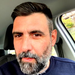 Bearded Man in Car with Short Hair