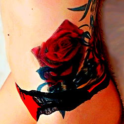 Vivid Tattoo of a Rose with Red Lace Bikini
