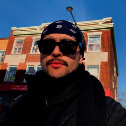 A Man in a Bandana on a Street
