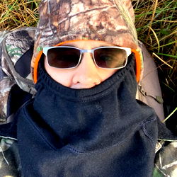 Doc G in Camo Outfit, Sunglasses and Face Mask in Field