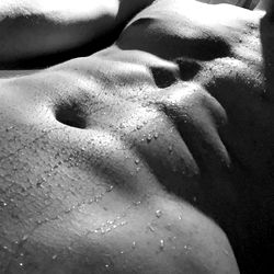 Model in Shower with Soapy Muscles