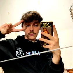 Artie, a young adult male model posing with phone in hand