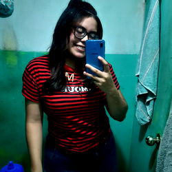 Smiling Woman Standing in Bathroom