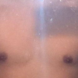 Shirtless Man in Bathroom