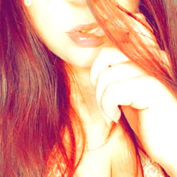 ShyNikki, a social media influencer with red hair and striking makeup.