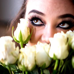Seattle-based model Allyson Dianna showcases her beauty with a bouquet of white roses in front of her face