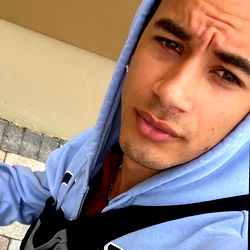 Double A: A Young Male With a Tattoo and Sunglasses